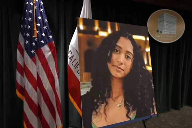 Photo of Celeste Rivas Hernandez in front of American Flag and CA state flag