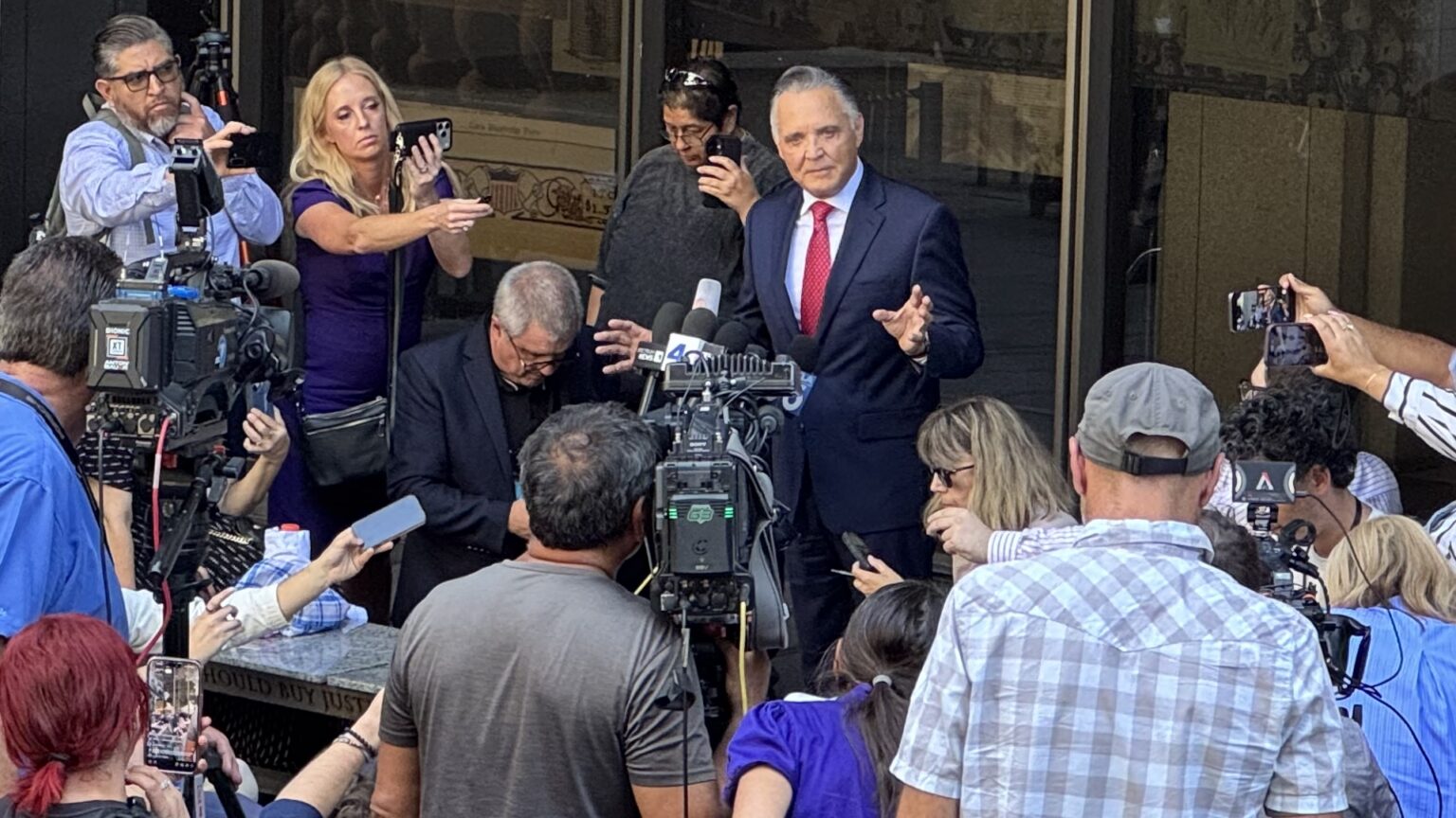 Attorney Patrick Steinfeld addressing the media outside of a Los Angeles courthouse